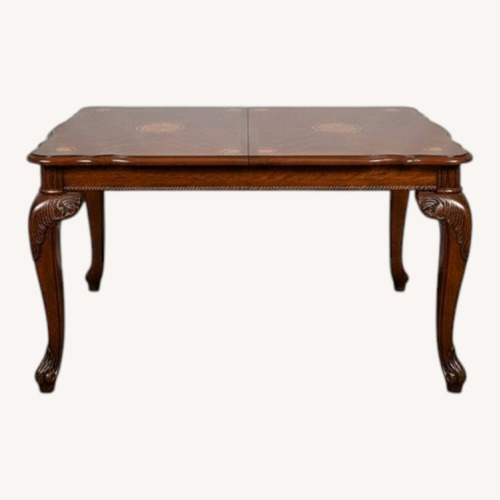 Used Dark Brown Wood Dining Table for sale on AptDeco