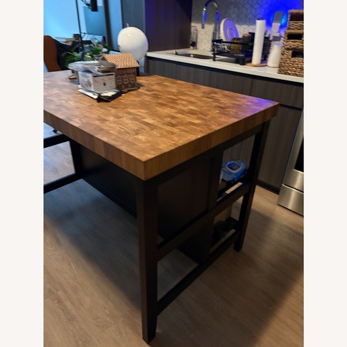 Used IKEA Natural Wood Kitchen Island for sale on AptDeco