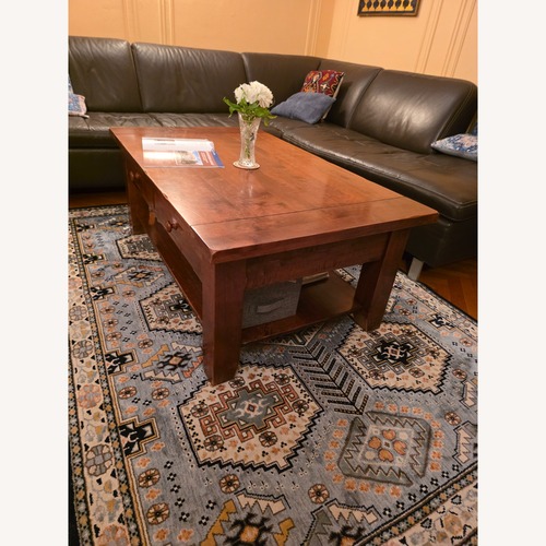 Used Dark Brown Wood Coffee Table for sale on AptDeco