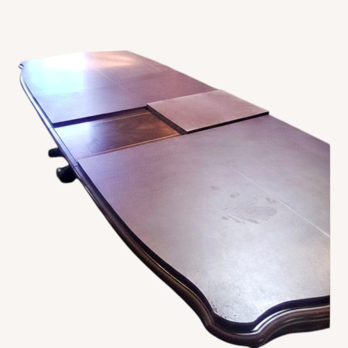 Used Dark Brown Wood Dining Table for sale on AptDeco