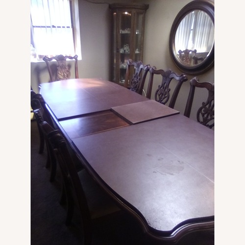 Used Dark Brown Wood Dining Table for sale on AptDeco