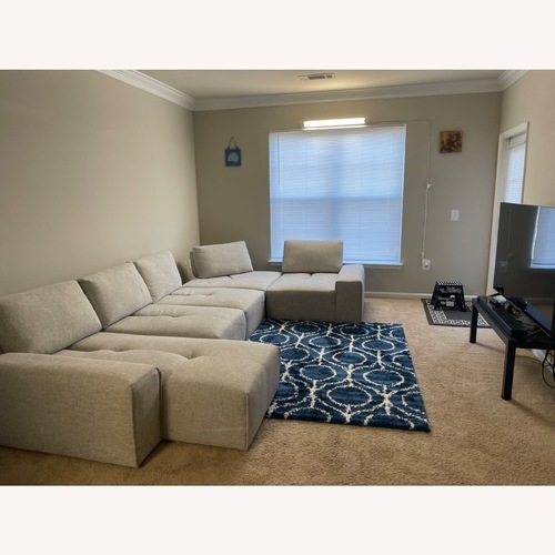Used Rooms To Go Sofa with a Chaise and Corner Part for sale on AptDeco
