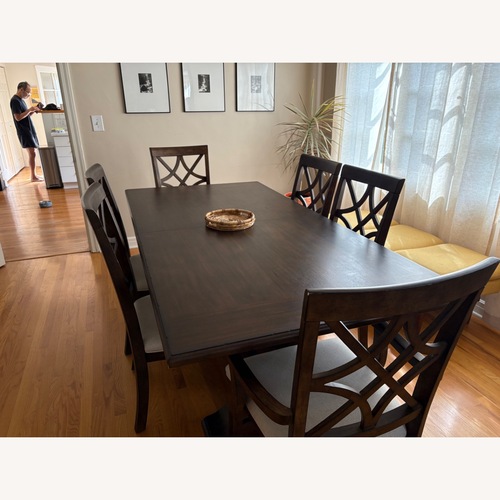 Used Dark Brown Wood Dining Table for sale on AptDeco