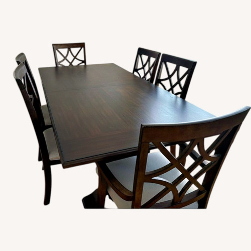 Used Dark Brown Wood Dining Table for sale on AptDeco