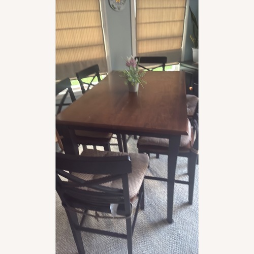 Used Dark Brown Wood Dining Table for sale on AptDeco