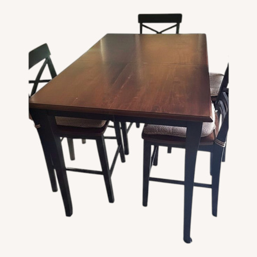 Used Dark Brown Wood Dining Table for sale on AptDeco
