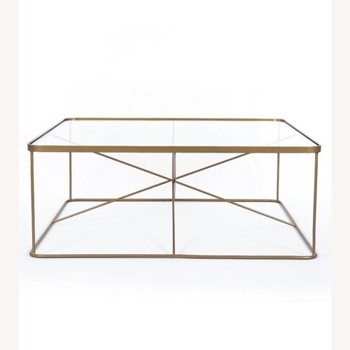 Used Pottery Barn Dark Brown Glass Coffee Table for sale on AptDeco