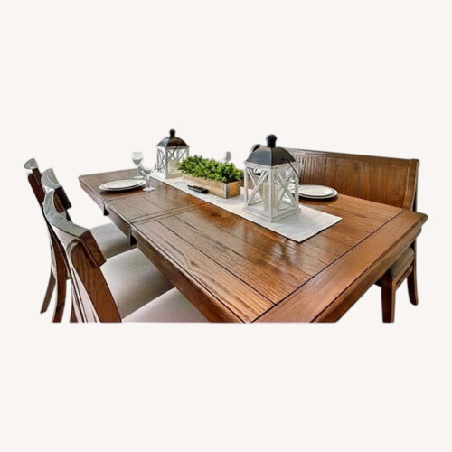 Used Ashley Furniture Natural Wood Dining Table for sale on AptDeco