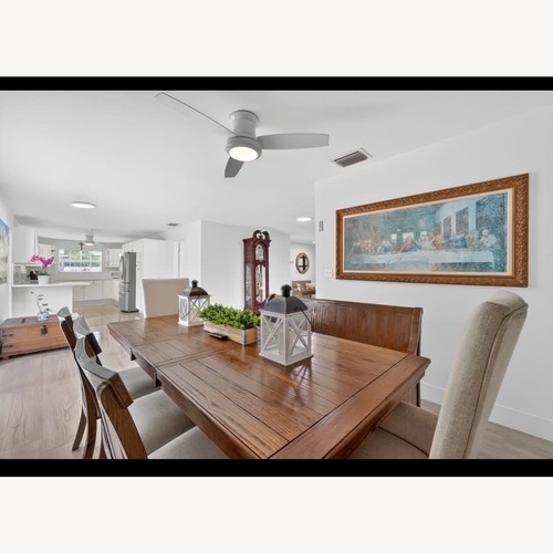 Used Ashley Furniture Natural Wood Dining Table for sale on AptDeco
