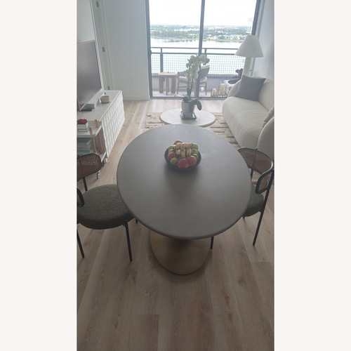 Used Crate & Barrel Grey & Gold Tulip Oval Bistro Dining Room Table for sale on AptDeco