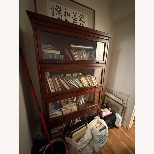 Used Vintage/Antique Dark Brown Wood Bookcase for sale on AptDeco