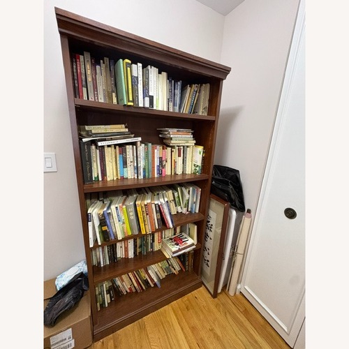 Used Vintage/Antique Dark Brown Wood Bookcase for sale on AptDeco