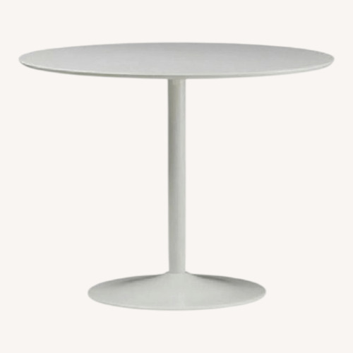 Used CB2 Odyssey Round White Tulip Dining Table for sale on AptDeco