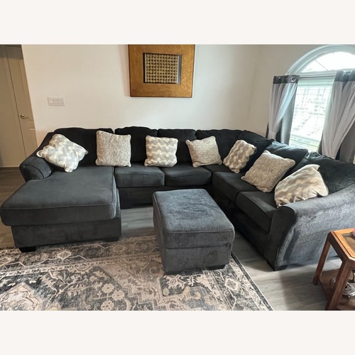 Used Ashley Furniture Dark Gray 3+ Piece Sectional With Ottoman for sale on AptDeco