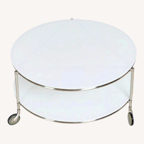 Used IKEA Vintage Strind White Glass Coffee Table space for sale on AptDeco