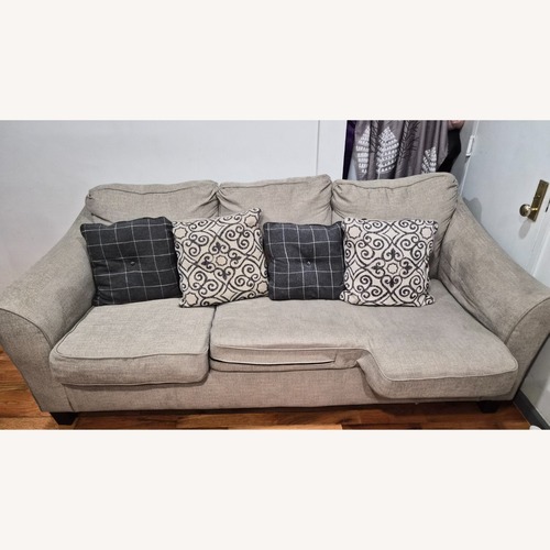 Used Ashley Furniture Sleeper Sofa with Ottoman for sale on AptDeco