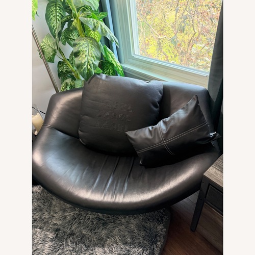Used Heals Gerard Van Den Berg Black Leather Gigi Swivel Armchair for sale on AptDeco