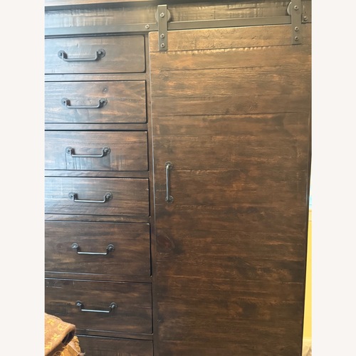 Used Raymour & Flanigan Dark Brown Wood Armoire for sale on AptDeco