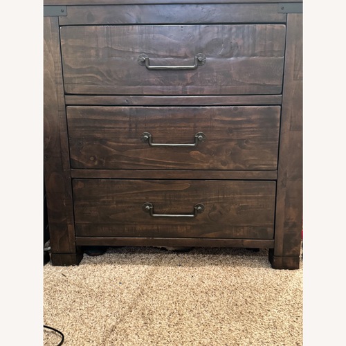 Used Raymour & Flanigan Dark Brown Wood Dresser for sale on AptDeco