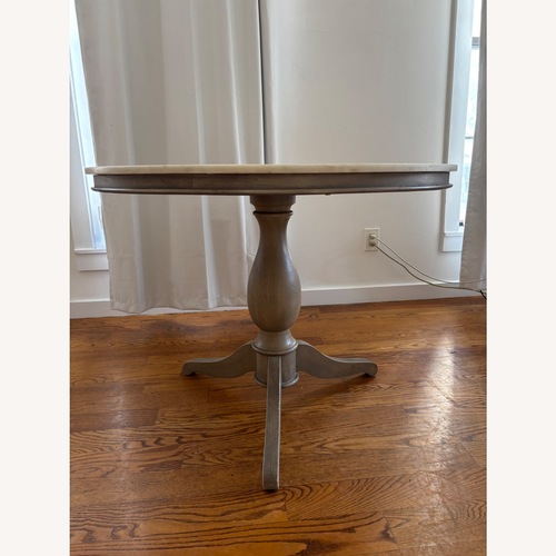 Used Pottery Barn Alexandra Table with Granite Top for sale on AptDeco