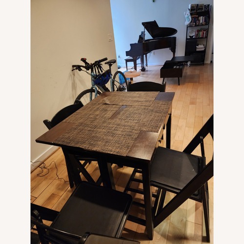 Used Dark Brown Dining Table for sale on AptDeco