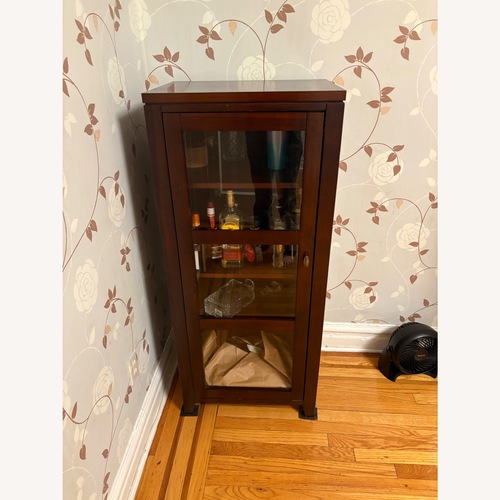 Used Crate & Barrel Dark Brown Wood Bar Cabinet for sale on AptDeco