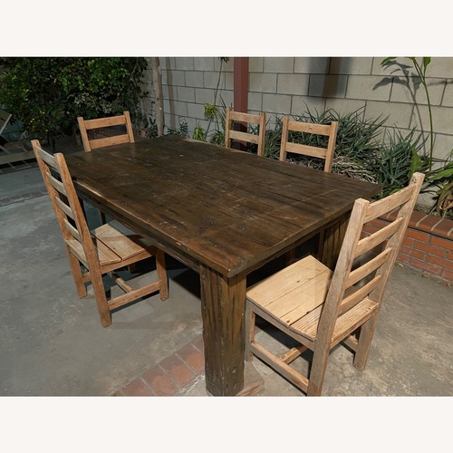 Used Outdoor Barn Style Table and 5 Chairs for sale on AptDeco