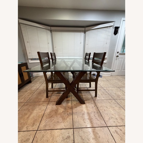 Used Pier 1 Imports Dark Brown Glass Top Dining Set for sale on AptDeco