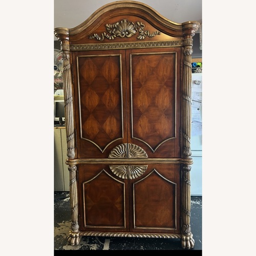 Used Dark Brown Wood Armoire for sale on AptDeco