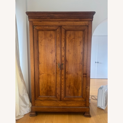 Used French Heritage Light Brown Wood Armoire for sale on AptDeco