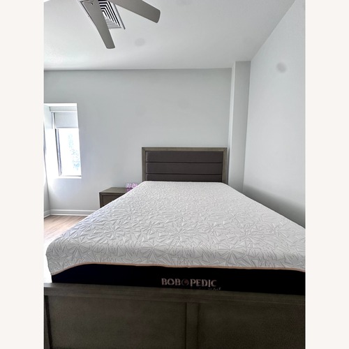 Used Queen Gray Upholstered Storage Panel Bed  for sale on AptDeco