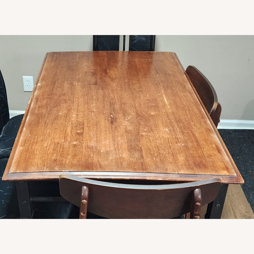 Used Light Brown Wood Dining Table for sale on AptDeco