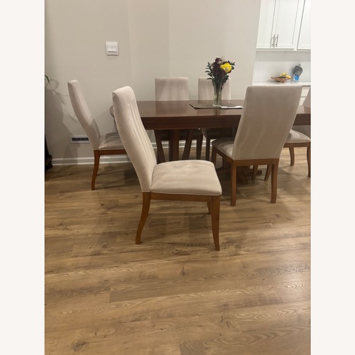 Used Dark Brown Wood Dining Set for sale on AptDeco
