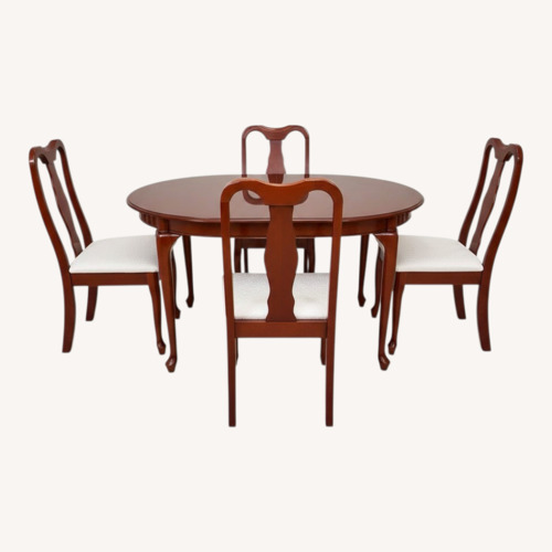 Used Dark Brown Wood Dining Set with Leaf for sale on AptDeco