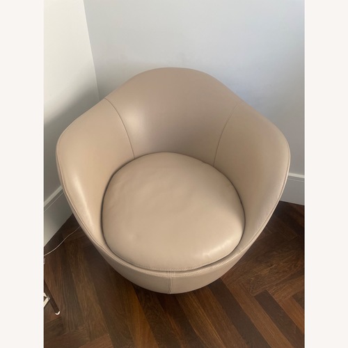 Used Tan Leather Accent Swivel Chair for sale on AptDeco