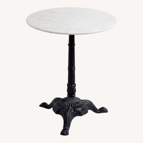 Used World Market Round White Marble and Black Metal Bistro Side Table for sale on AptDeco