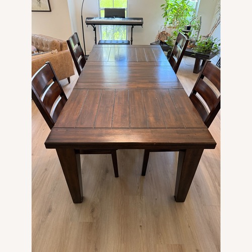 Used Ashley Furniture Dark Brown Wood Dining Set for sale on AptDeco