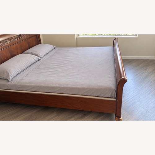 Used Dark Brown Wood King Bed for sale on AptDeco