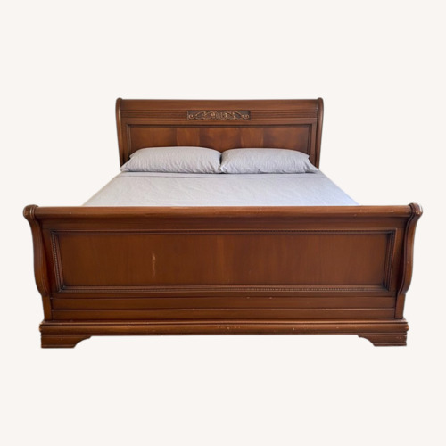 Used Dark Brown Wood King Bed for sale on AptDeco