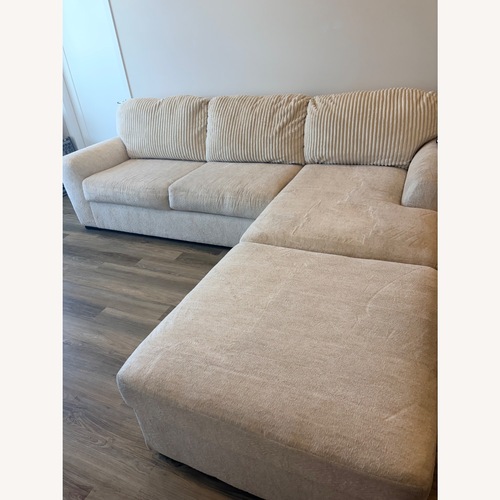 Used Cream Sectional Sofa + Oversized Ottoman for sale on AptDeco