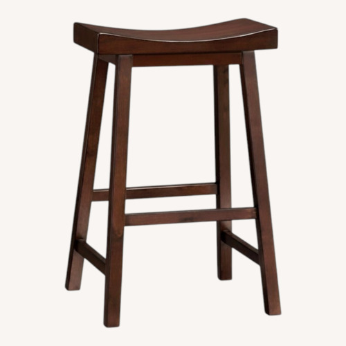 Used Pottery Barn Tibetan Dark Brown Wood Stools for sale on AptDeco