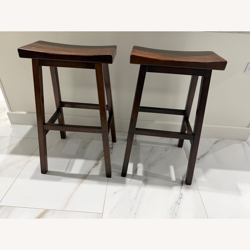 Used Pottery Barn Tibetan Dark Brown Wood Stools for sale on AptDeco