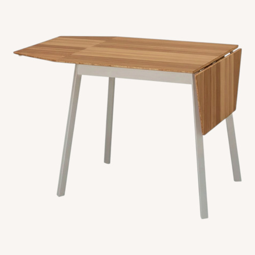 Used IKEA PS 2012 Natural Wood Dining Table for sale on AptDeco