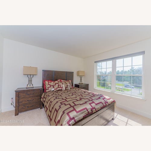 Used Dark Brown Wood Queen Bed for sale on AptDeco