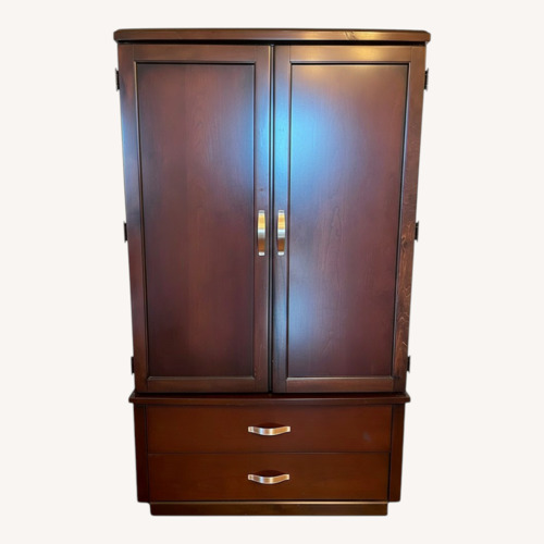 Used Dark Brown Wood Armoire for sale on AptDeco