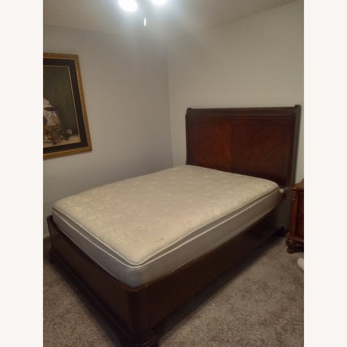 Used Cherry Finish Queen Bed Frame for sale on AptDeco