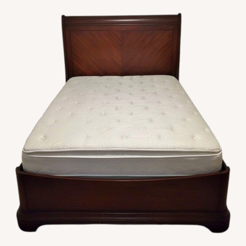 Used Cherry Finish Queen Bed Frame for sale on AptDeco