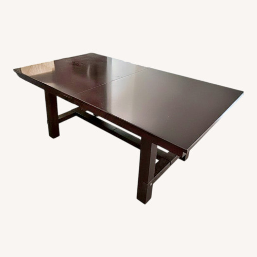 Used Dark Brown Wood Dining Table for sale on AptDeco
