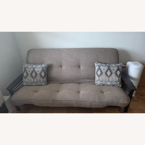 Used Dark Brown Wood Futon for sale on AptDeco