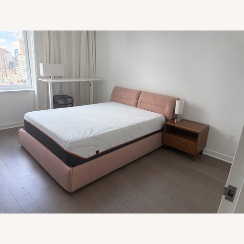 Used Bonaldo Pink Fabric Queen lift Bed Frame for sale on AptDeco